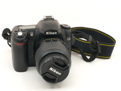 Kamerahus och objektiv Nikon ur funktion