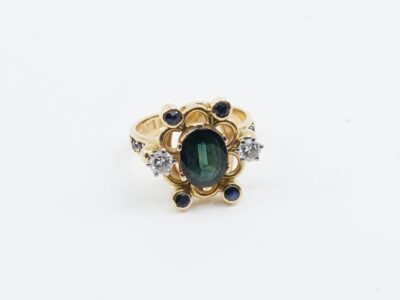 Ring Guld 18K 7,9g Ø17½ med blå/svarta stenar och diamanter 2xca 0,2ct