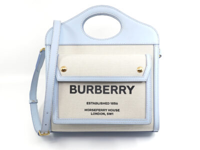 Väska Burberry Mini Pocket Bag ljusblå