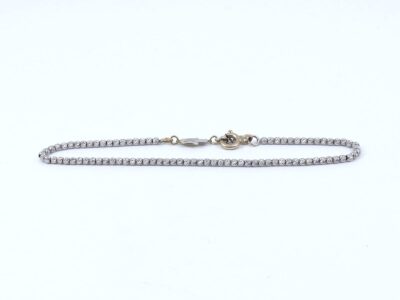 Armband Tvåfärgat Guld 18K 3g Längd 16,5-19cm Bredd 2mm