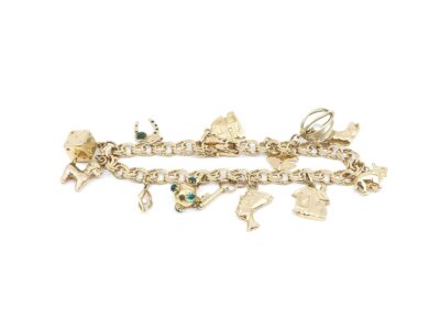 Armband Bismarck med 13 Berlocker Guld 18K L 19cm B 7mm