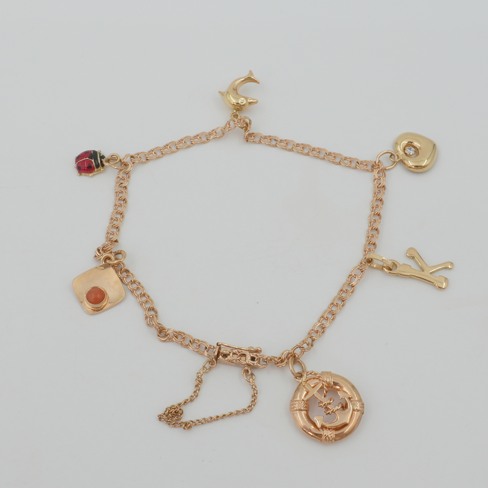 Armband Bismarck med berlocker Guld 18K 6,2g Längd 19cm Kistlås