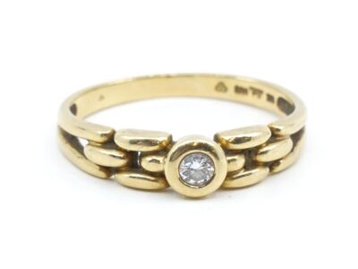 Ring med diamant 1xca0,08ct Guld 18K 3,1g Ø17,5