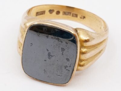 Klackring 18K med svart sten Ø20,75