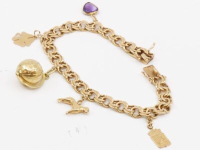 Armband Bismarck 18K med 5 berlocker Längd 19cm