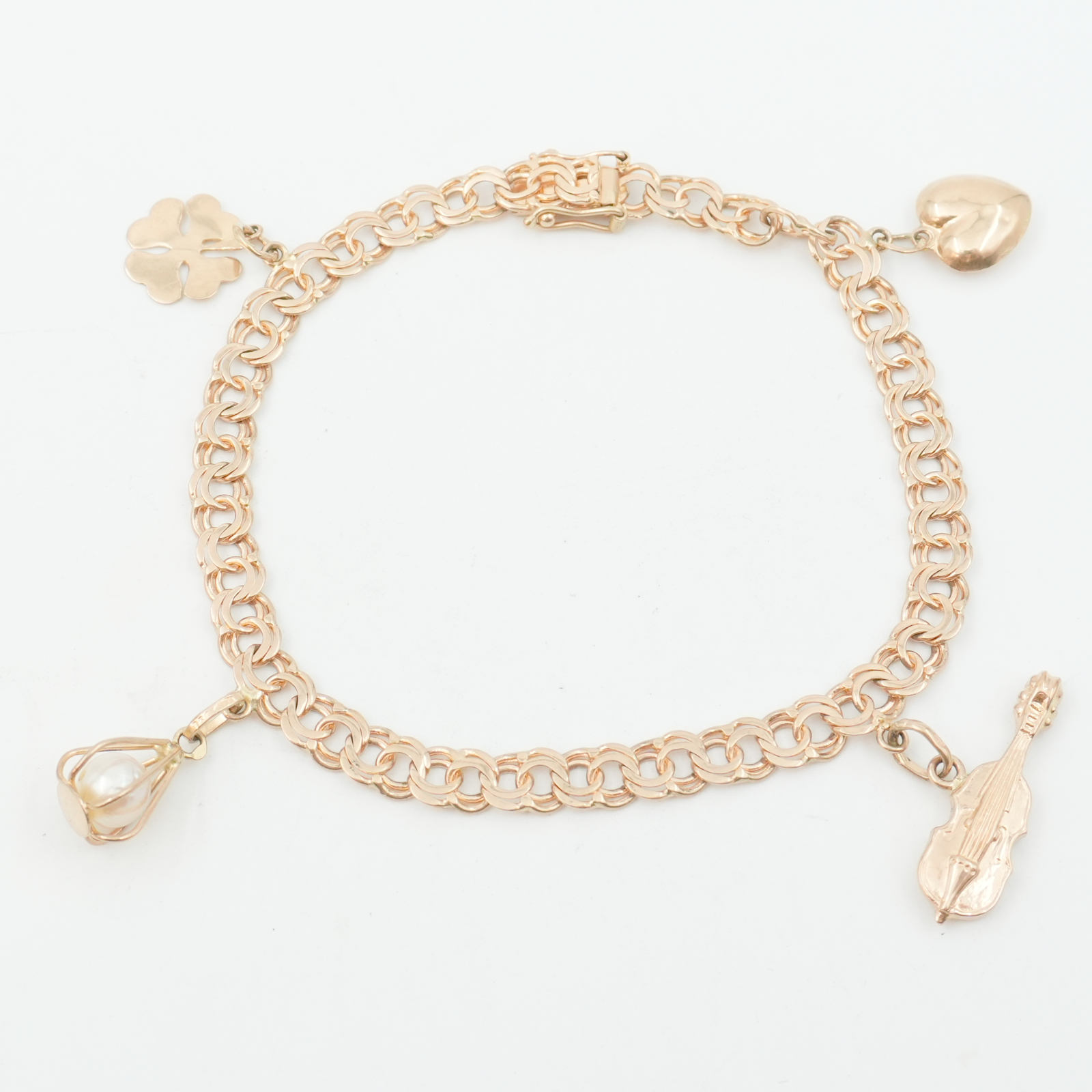 Armband Guld 18K Bismarck med fyra berlocker 12,5g Längd 21cm